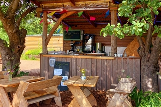 Image of cafe area at Grow Wilder, with benches outside