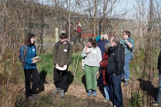 Members of the Youth Leadership Group talking to local residents during a tour of Grow Wilder